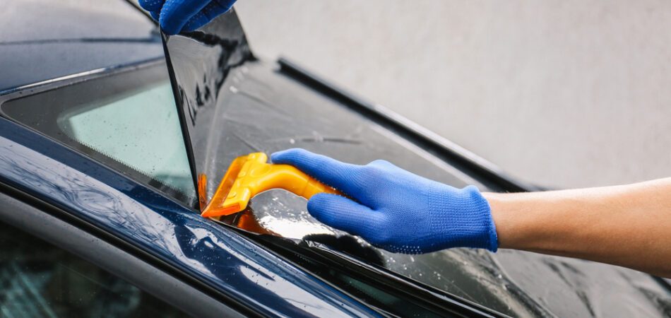 Male,worker,tinting,car,window